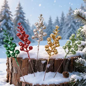 Festive glittery Christmas artificial berry branches in five colors on a snowy stump.