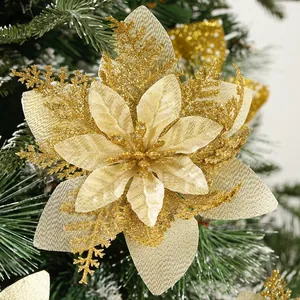Detailed macro shot of a gold glitter artificial poinsettia flower for Christmas tree