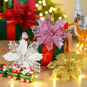 Detailed view of shimmering double-layer artificial poinsettia for Christmas tree decor.