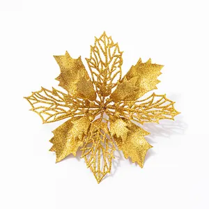 Detail of golden glitter double-layer poinsettia artificial flower for Christmas tree decor.