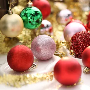 Close-up view of colorful glitter and matte Christmas ball ornaments for festive tree decor