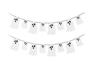Close-up detail of cute white ghost felt garland banner for Halloween party wall decoration