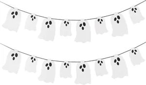 Macro view of white pearly paper ghost garland banners for Halloween party decoration