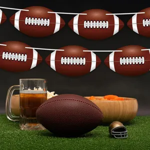 Detailed view of football-themed party banner hanging above a game day snack table