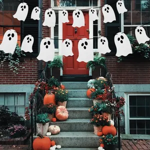 Spooky white paper ghost garland for Halloween outdoor party decoration on front porch