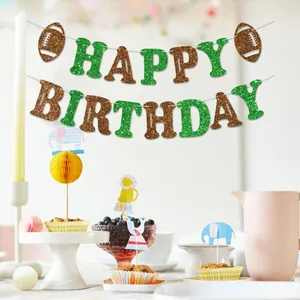Glittery football-themed Happy Birthday banner decoration hanging in a party scene.