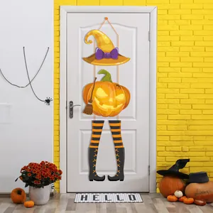 Halloween door hanging decor with witch hat, glowing pumpkin and striped legs.