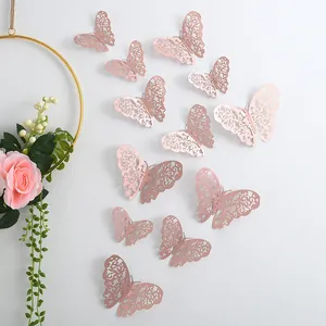 Rose gold 3D hollow butterfly wall stickers for home and wedding decor.