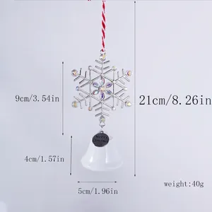 Silver snowflake ornament with white bell showing height and width measurement details