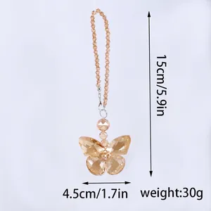 Detailed view of champagne crystal butterfly suncatcher with measurements and weight
