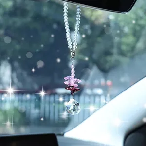 Close-up of a crystal suncatcher with purple octagonal beads and a faceted glass ball