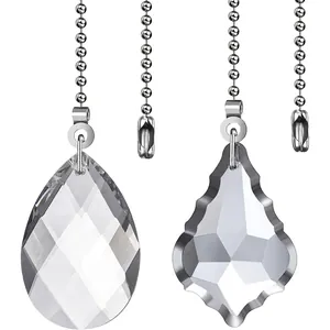 Detailed view of transparent teardrop and maple leaf crystal fan pull chains.