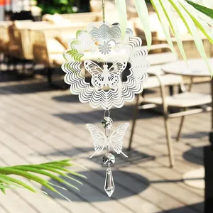 Close-up detail of 3D metal butterfly mandala wind spinner with crystal pendant sun catcher