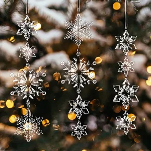 Detailed macro view of crystal snowflake hanging ornaments on a Christmas tree