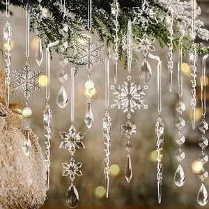 Detail view of clear acrylic Christmas icicle and snowflake pendants for holiday decor.