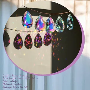 Close-up detail showing teardrop crystal prisms with vibrant rainbow light refraction effects