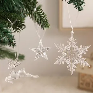 Close-up of clear acrylic Christmas pendants featuring reindeer, star, and snowflake.