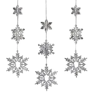 Close-up of sparkling clear acrylic snowflake ornaments for DIY Christmas tree decor