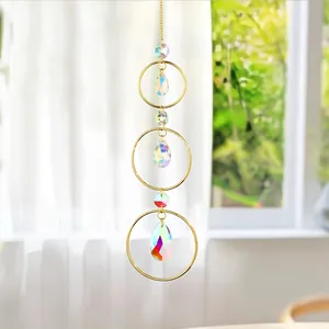 Detail of 3-tier golden suncatcher with iridescent crystal waterdrop prisms
