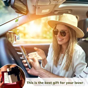 Lily of the valley suncatcher car hanging ornament shown in a sunlit vehicle interior