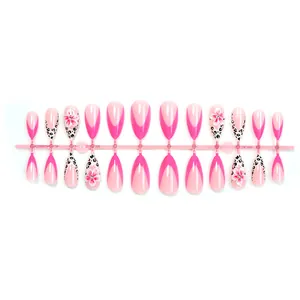 Detailed view of pink French almond press-on nails with leopard print and 3D flowers