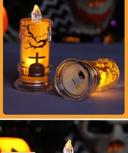 Detail of Halloween LED candle light showing bottom switch and spooky tree silhouette