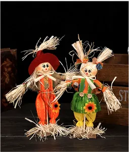 Detailed view of standing scarecrow decorations for autumn harvest and Halloween theme.