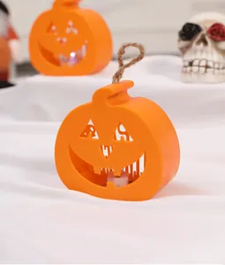 Close-up of orange pumpkin LED hanging light for Halloween scene decoration