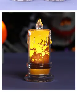 Detailed macro shot of an LED Halloween candle lamp with haunted house silhouette