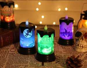 Colorful LED Halloween candle lights with witch and pumpkin graphics for party decor.