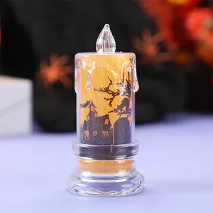 Halloween LED decorative candle lamp with haunted house silhouette and orange glitter.
