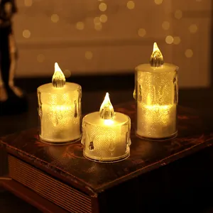 Faux crystal LED candles with warm glow on vintage book for festive room decor