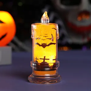 Halloween LED candle light with bat and graveyard silhouette for festive desktop decoration.