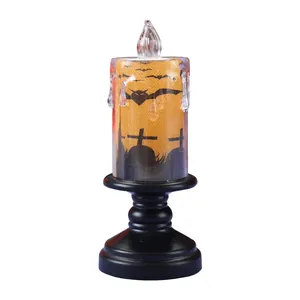 Vela LED de Halloween con pedestal negro y decoración de siluetas de murciélagos