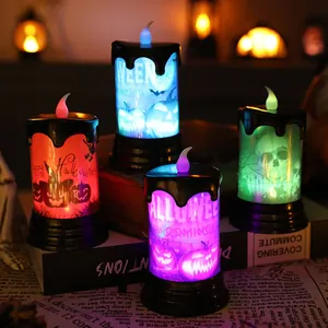Set of four colorful Halloween LED candle lights featuring skull and pumpkin patterns