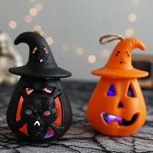 Decorative Halloween glowing pumpkin lanterns with witch hat skull and jack-o-lantern designs