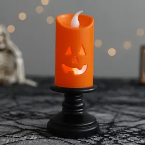 Spooky Halloween LED pumpkin candle light with black decorative base for festive table decor