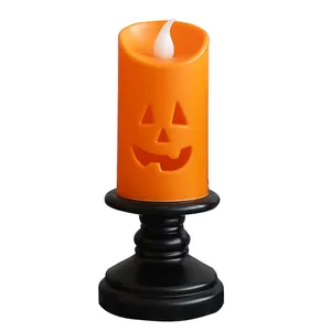 Halloween pumpkin LED candle light with black holder for spooky desktop festive decoration
