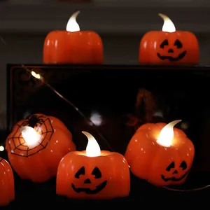 Atmospheric Halloween LED pumpkin tea lights with warm jack-o'-lantern flickering glow