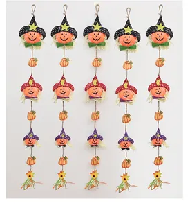 Detail view of five vertical Halloween scarecrow hanging strings with pumpkins