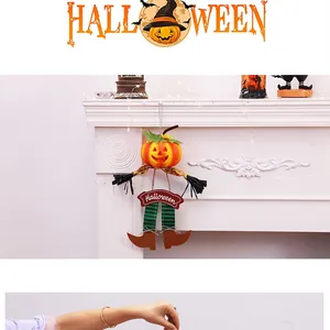 Detail view of a pumpkin scarecrow hanging decoration for Halloween fireplace decor