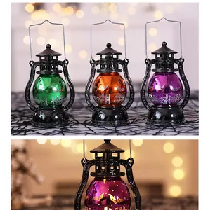 Detail view of colorful Halloween electronic lanterns featuring bat and graveyard patterns