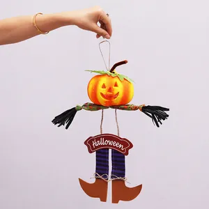 Handcrafted Halloween pumpkin hanging decoration with striped legs and door sign