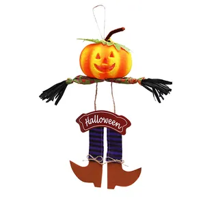 Festive hanging Halloween pumpkin decoration with jack-o-lantern head and striped legs