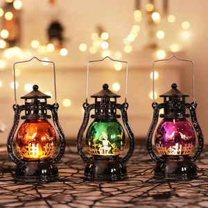 Set of three colorful Halloween electronic lanterns with pumpkin and skeleton motifs.
