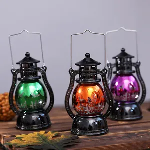 Set of three colorful Halloween lanterns with spooky patterns for table decoration