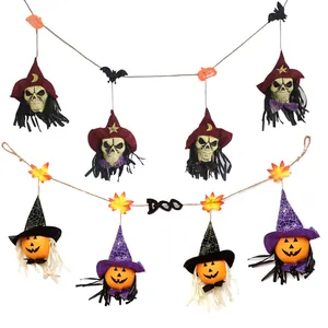 Scary Halloween banner garland with skeletons and pumpkins wearing witch hats for party