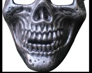 Detailed macro view of the realistic weathered metallic finish on a skull tactical mask