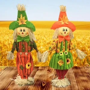 Pair of cute standing scarecrow ornaments for Halloween and Harvest festival decor.