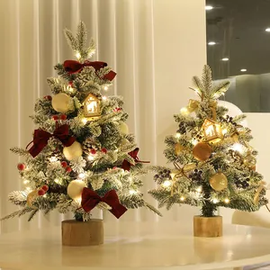 Mini sapin de Noël décoré avec flocage de neige et lumières LED chaudes